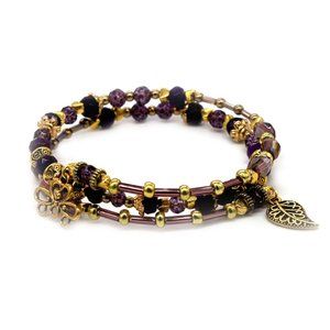 Bracelet with small purple beads and gold accents. Unique.